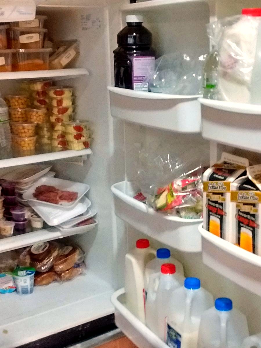 A Kosher-room refrigerator stocked with packed meals